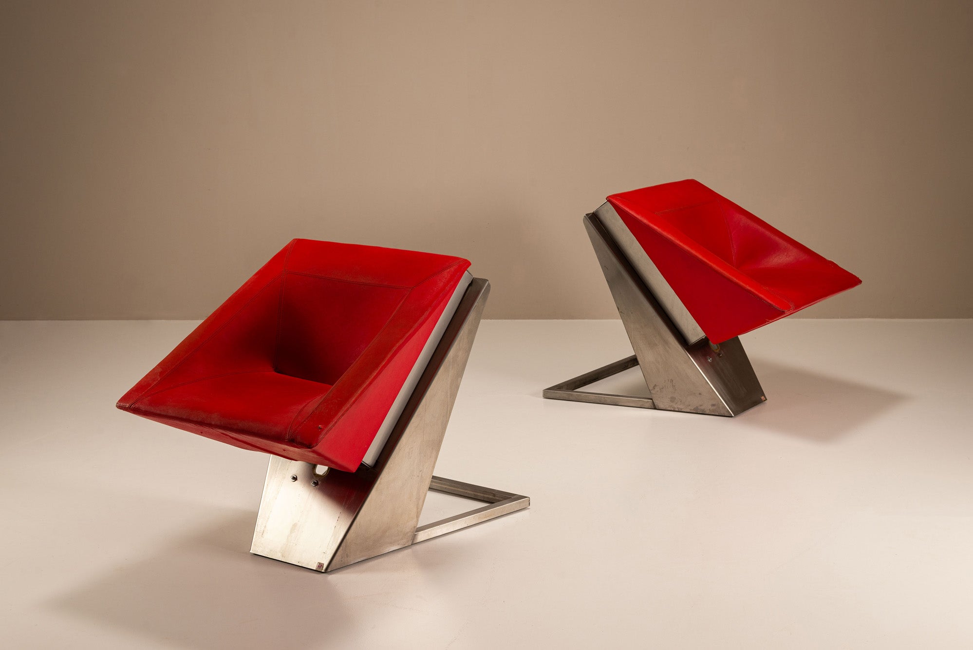 Set_of_2_Sculptural_Lounge_Chairs,_Metal_And_Red_Leather,_1960s,_Italy