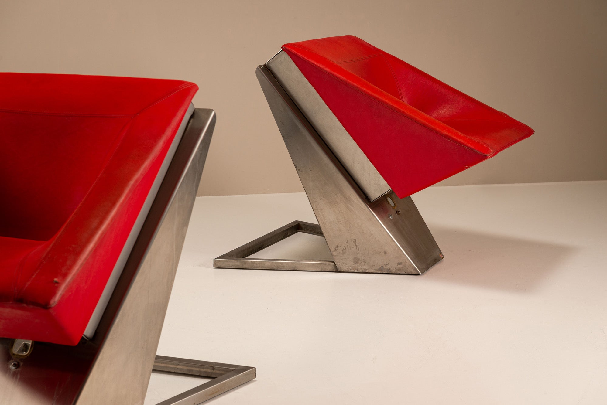 Set_of_2_Sculptural_Lounge_Chairs,_Metal_And_Red_Leather,_1960s,_Italy