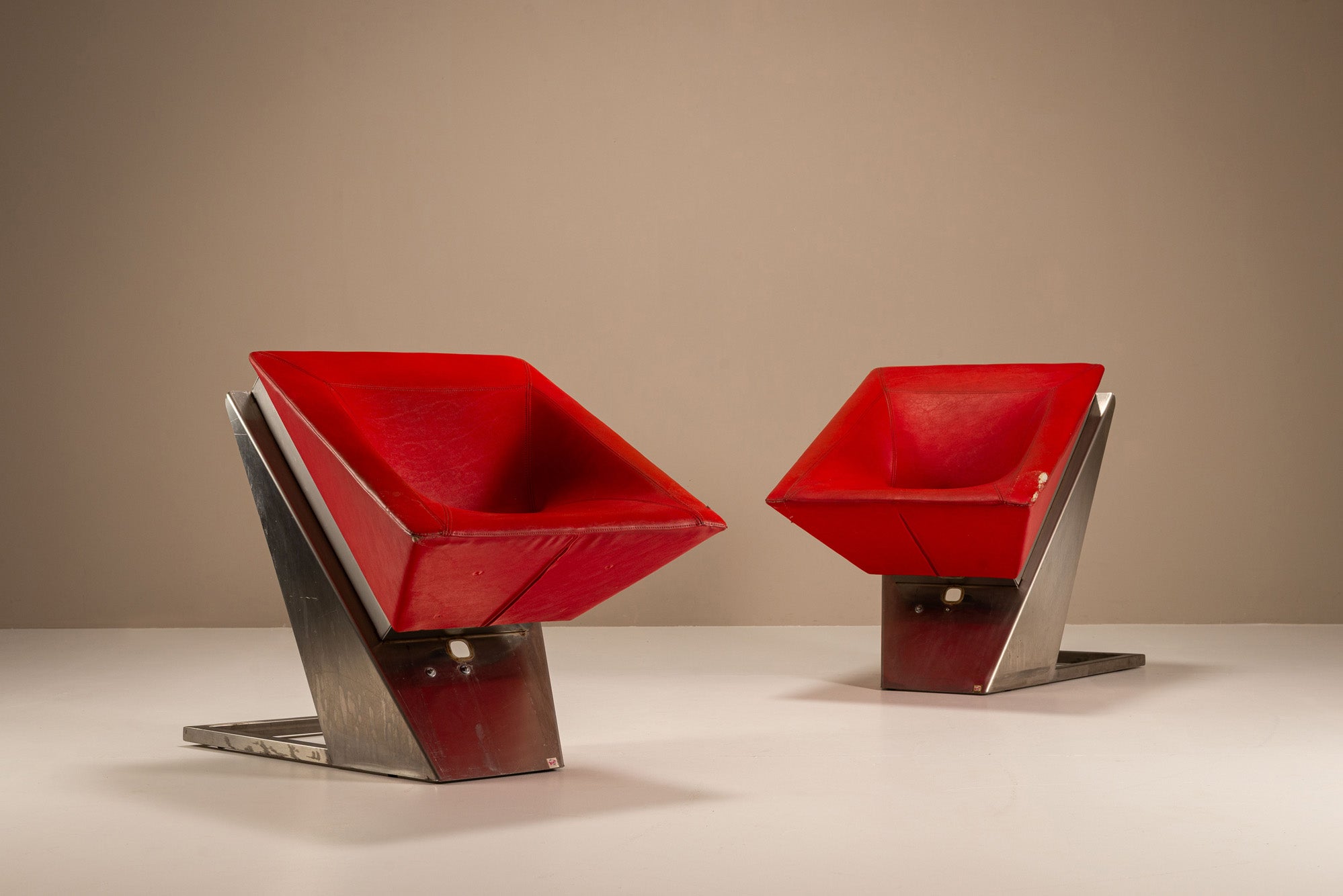 Set_of_2_Sculptural_Lounge_Chairs,_Metal_And_Red_Leather,_1960s,_Italy