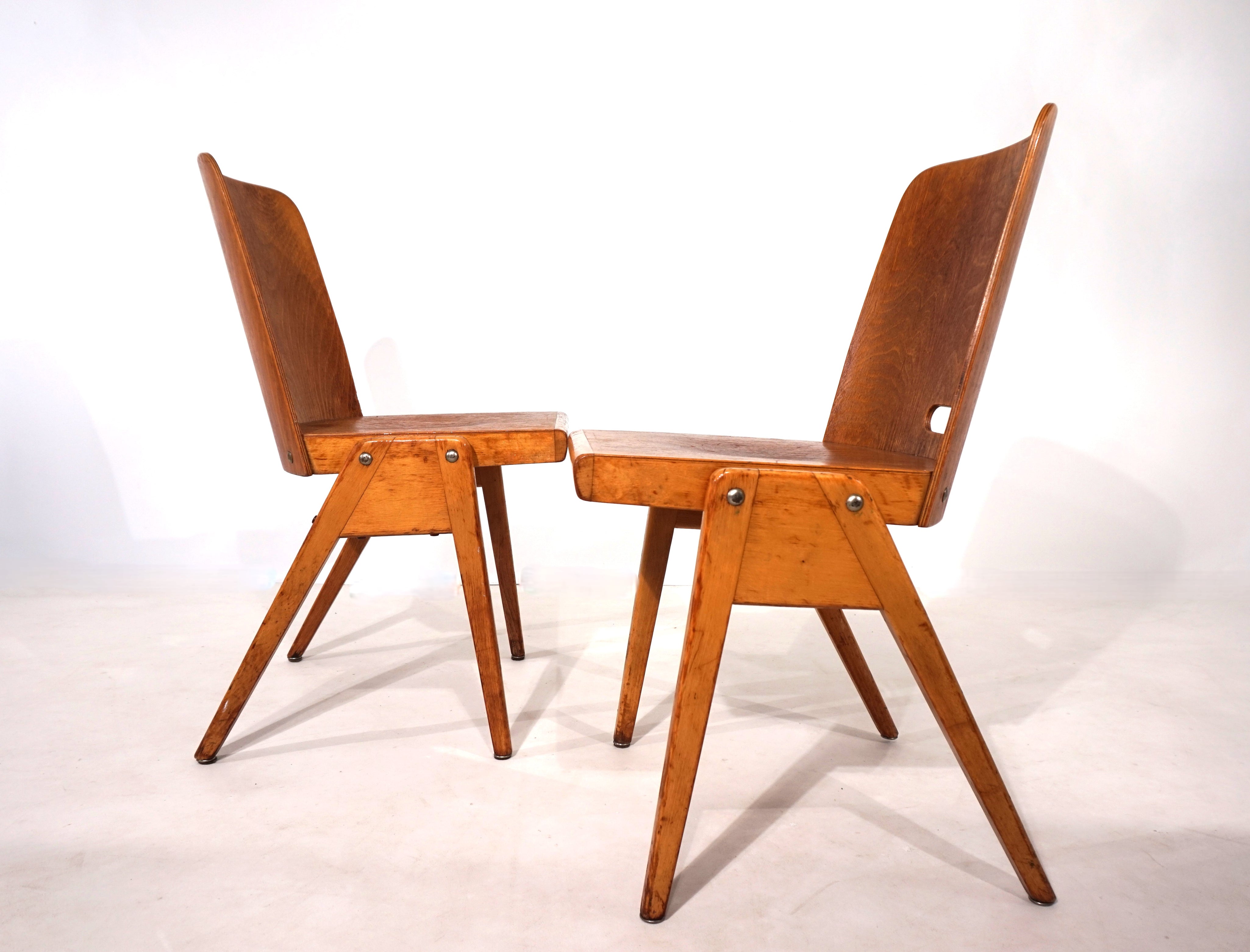 Set_of_2_stackable_plywood_dining_chairs_from_1960