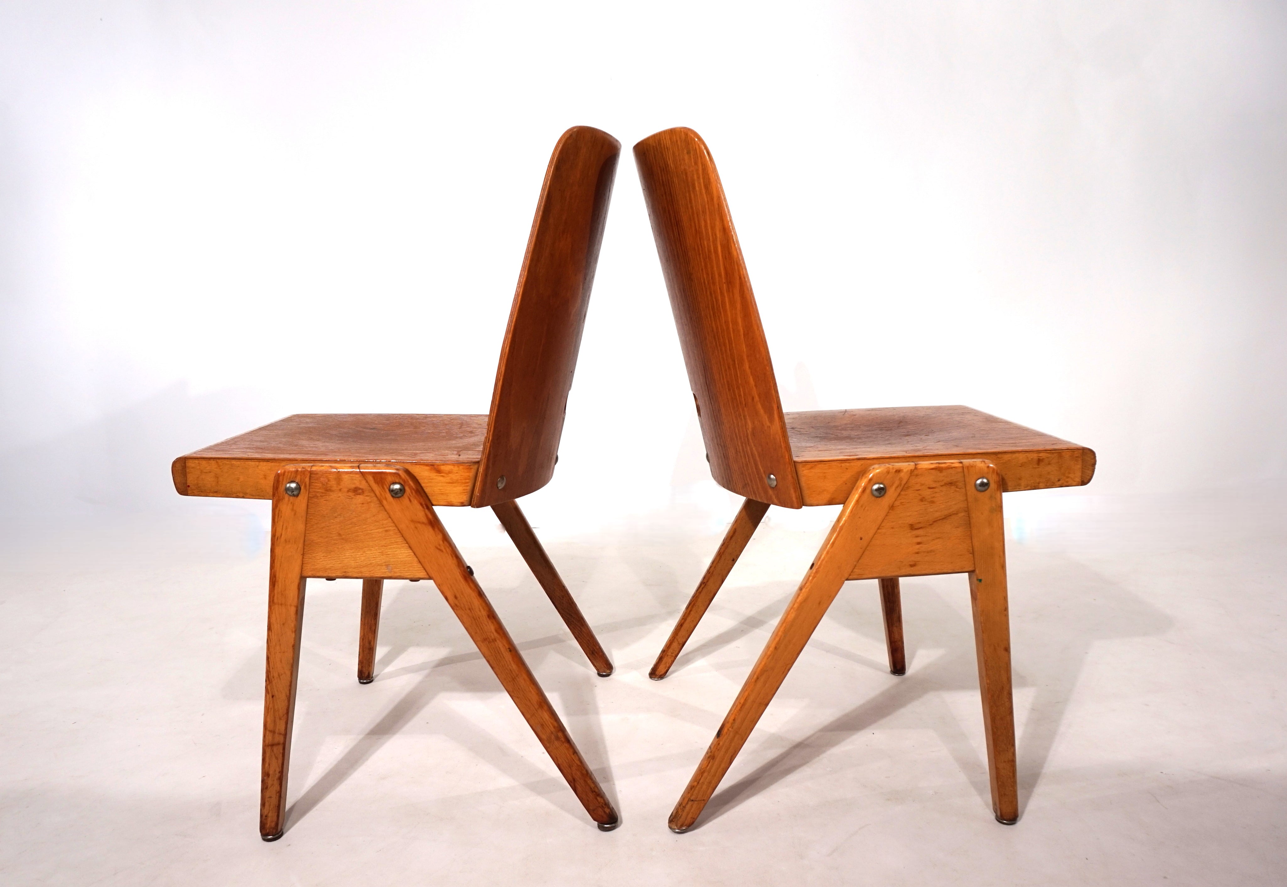 Set_of_2_stackable_plywood_dining_chairs_from_1960