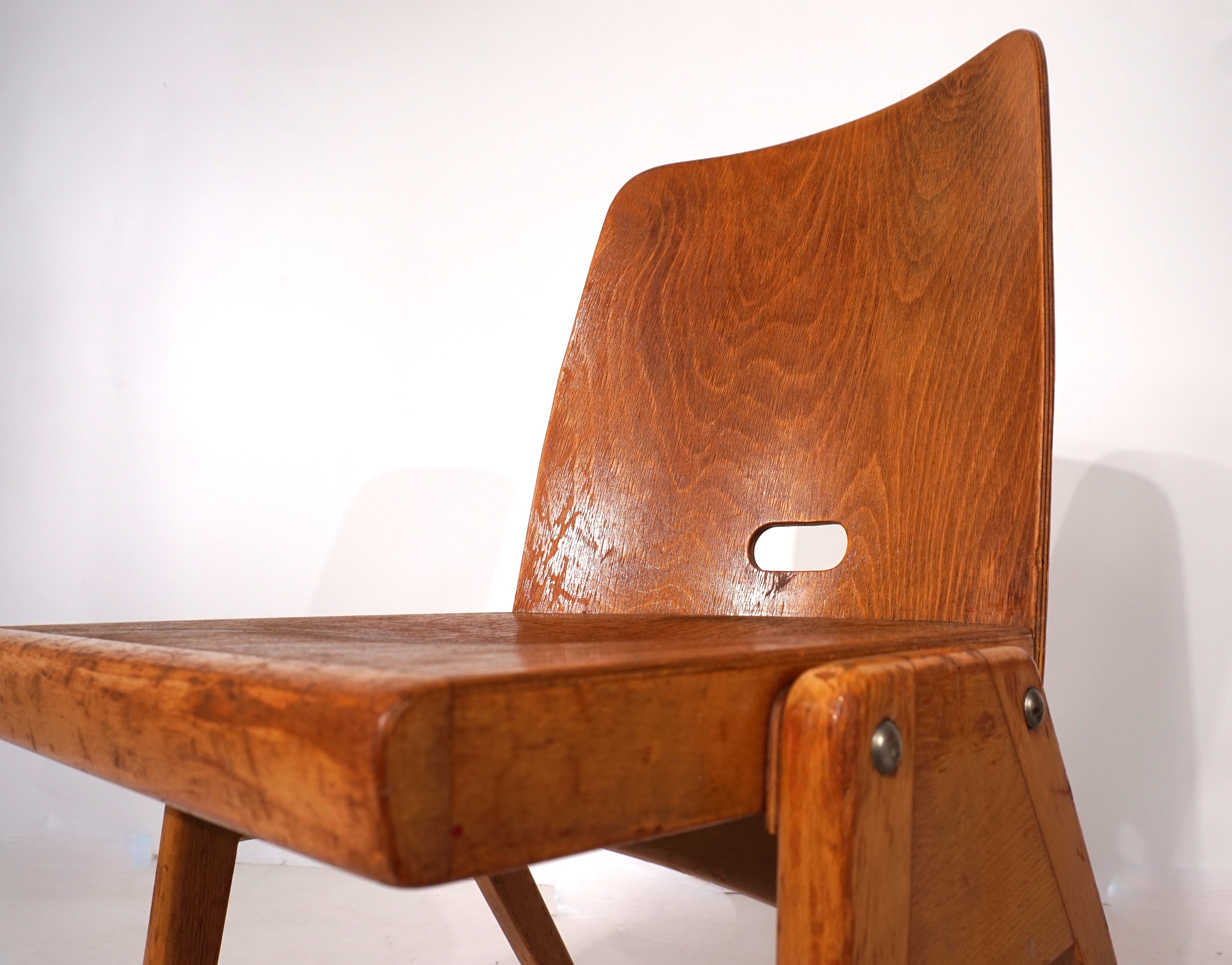 Set_of_2_stackable_plywood_dining_chairs_from_1960