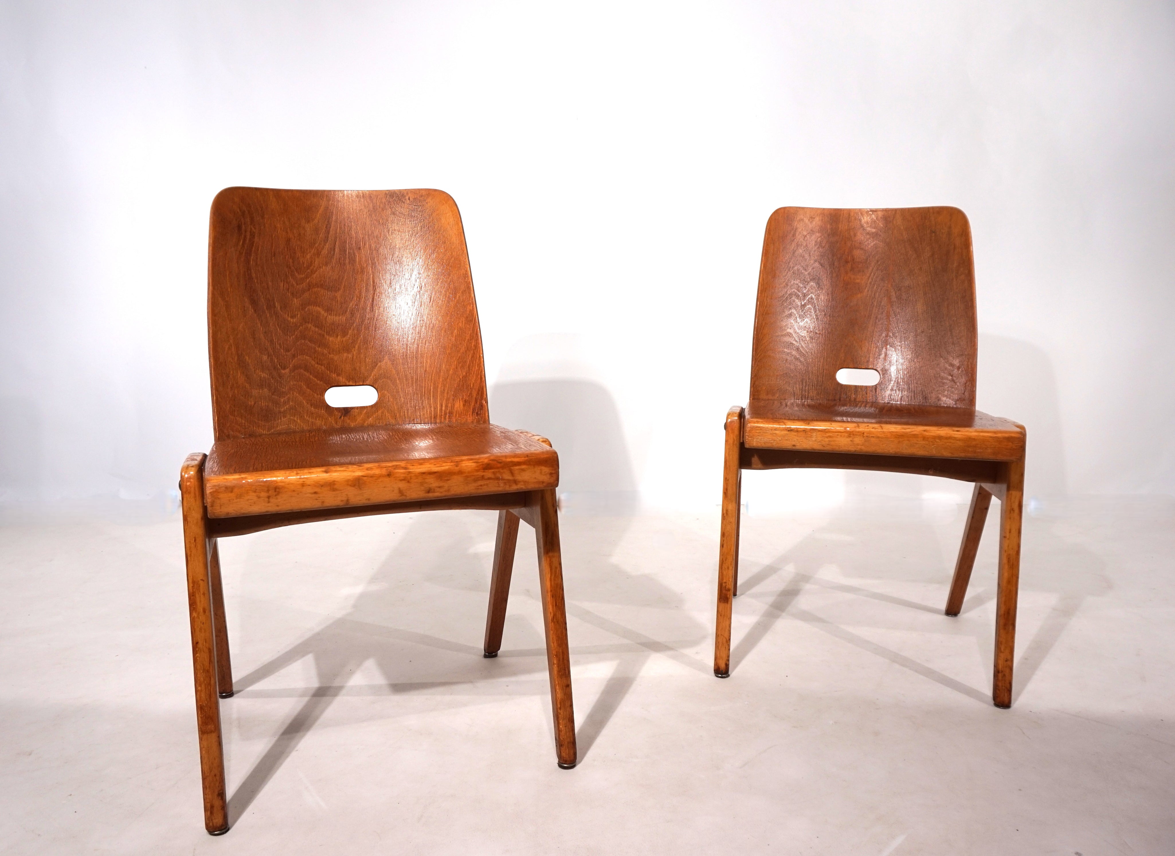 Set_of_2_stackable_plywood_dining_chairs_from_1960