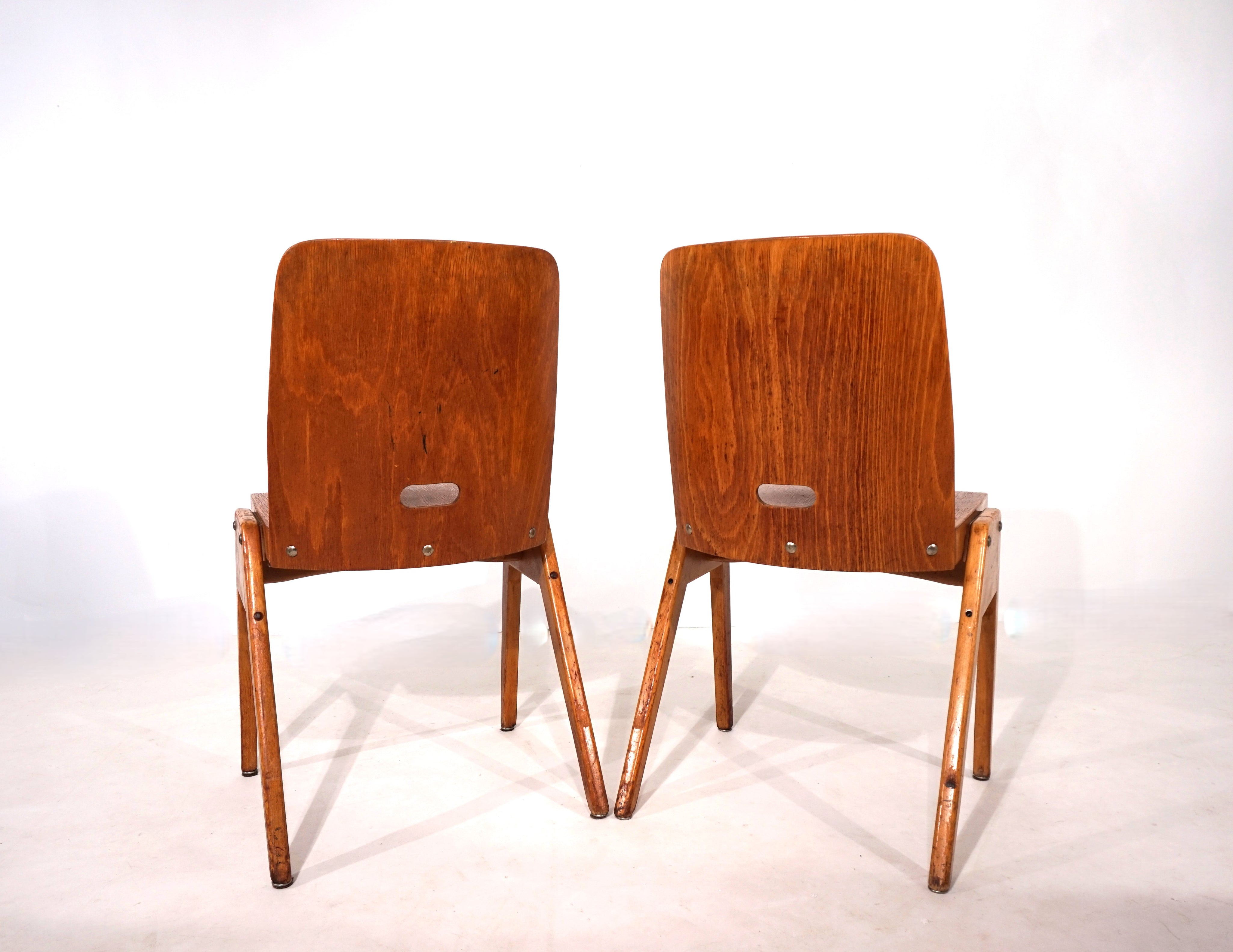 Set_of_2_stackable_plywood_dining_chairs_from_1960