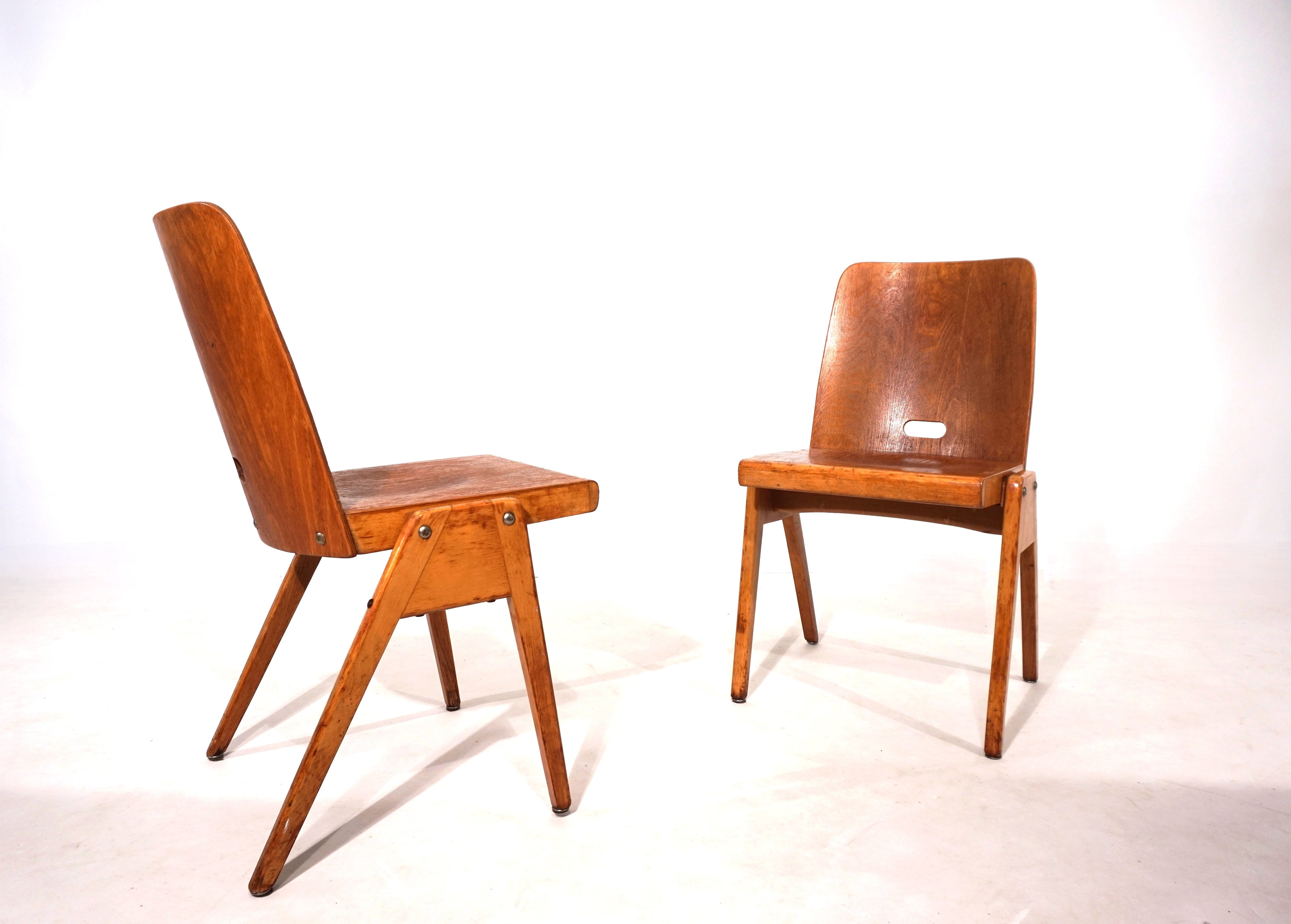 Set_of_2_stackable_plywood_dining_chairs_from_1960