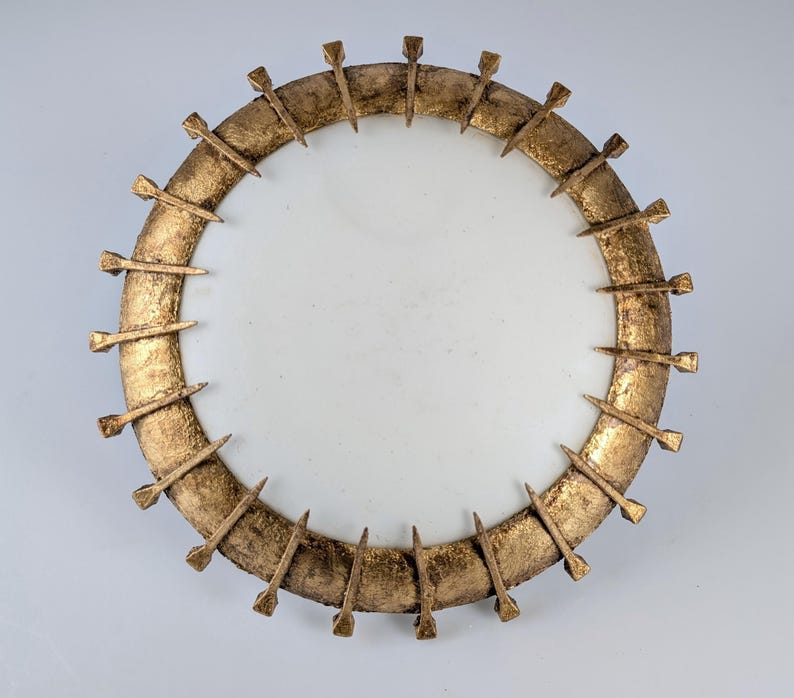 Sun_lamp_made_of_forged_nails_with_gold_leaf_and_opaline
