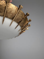Sun_Pendant_lamp_made_of_forged_nails_with_gold_leaf_and_opaline
