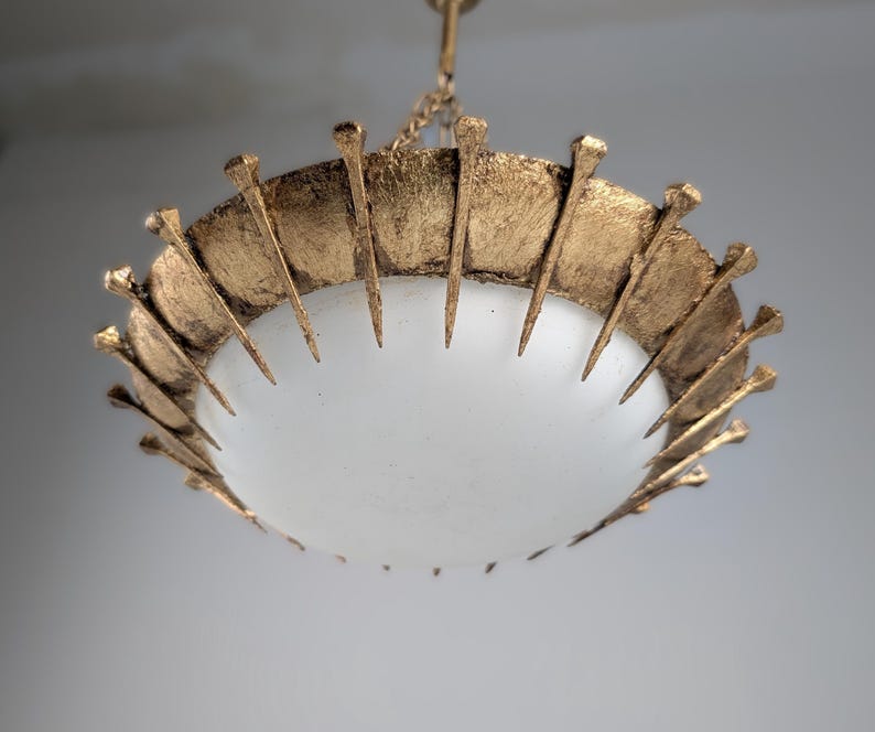 Sun_Pendant_lamp_made_of_forged_nails_with_gold_leaf_and_opaline