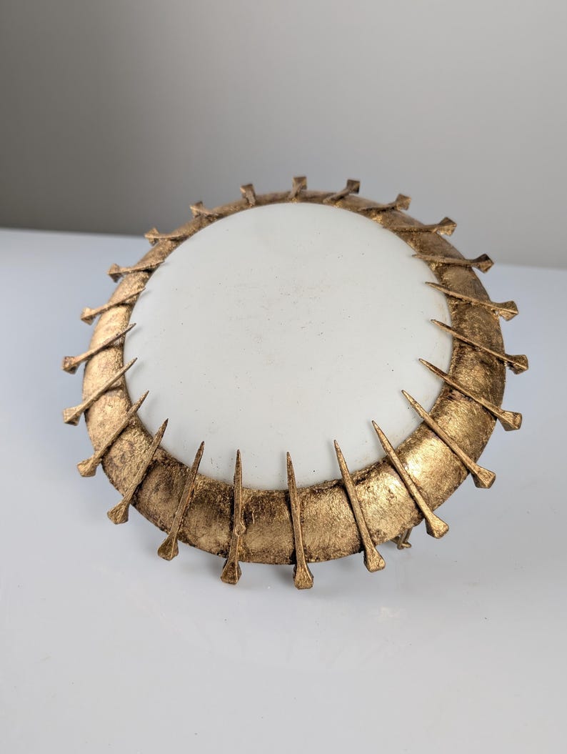 Sun_Pendant_lamp_made_of_forged_nails_with_gold_leaf_and_opaline