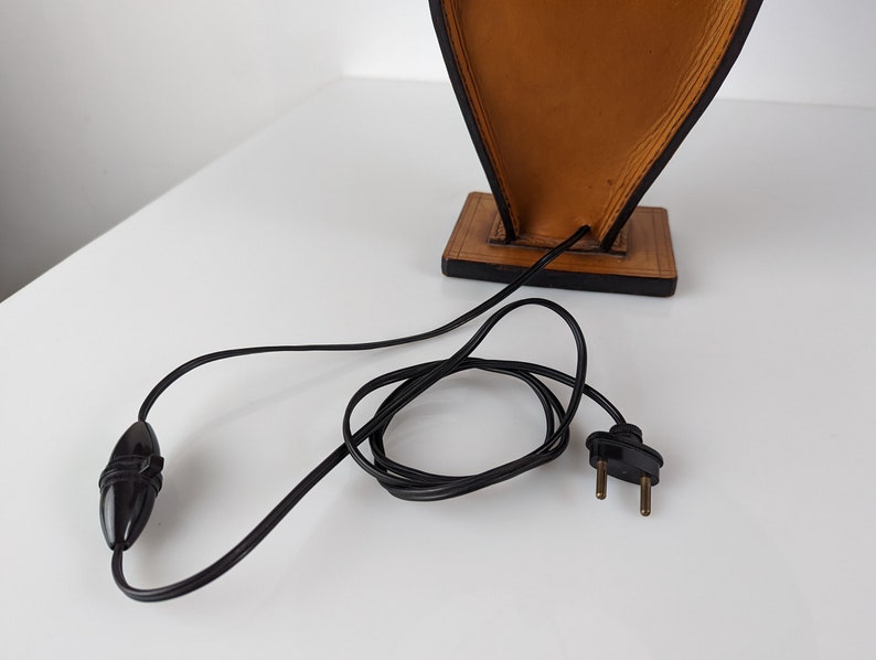 Table_lamp_in_leather_by_Jacques_Adnet_1940s
