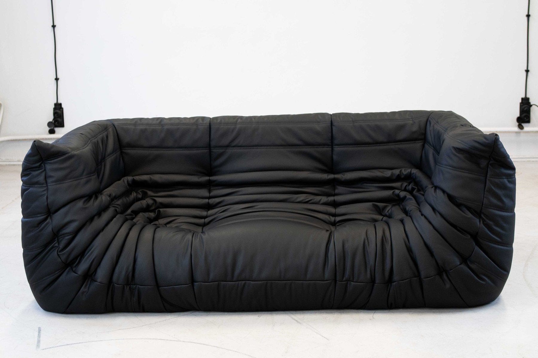 Togo_Two-Seater_Sofa_with_Arms_in_Black_Leather_by_Michel_Ducaroy_for_Ligne_Roset,_France,_1970s