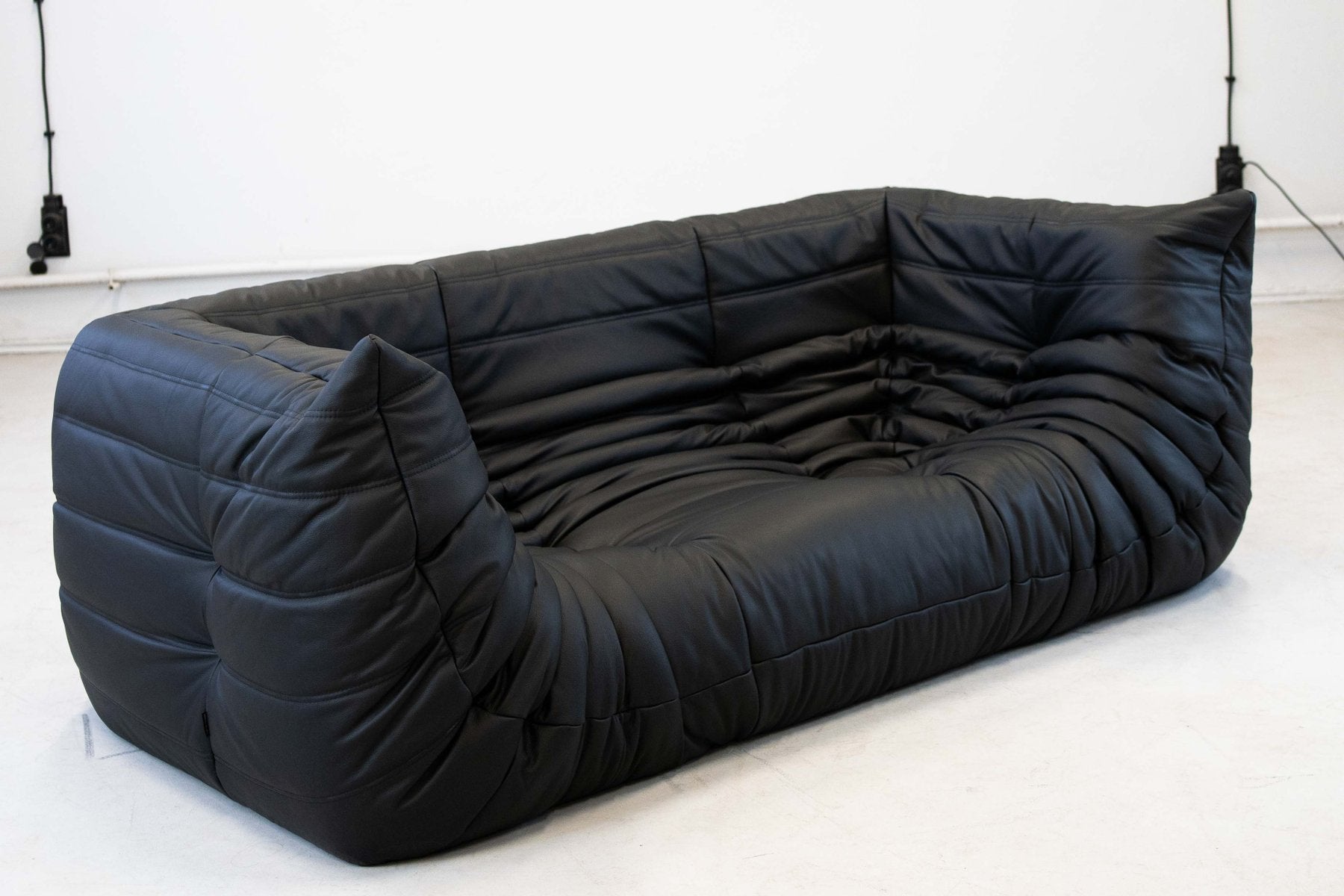Togo_Two-Seater_Sofa_with_Arms_in_Black_Leather_by_Michel_Ducaroy_for_Ligne_Roset,_France,_1970s