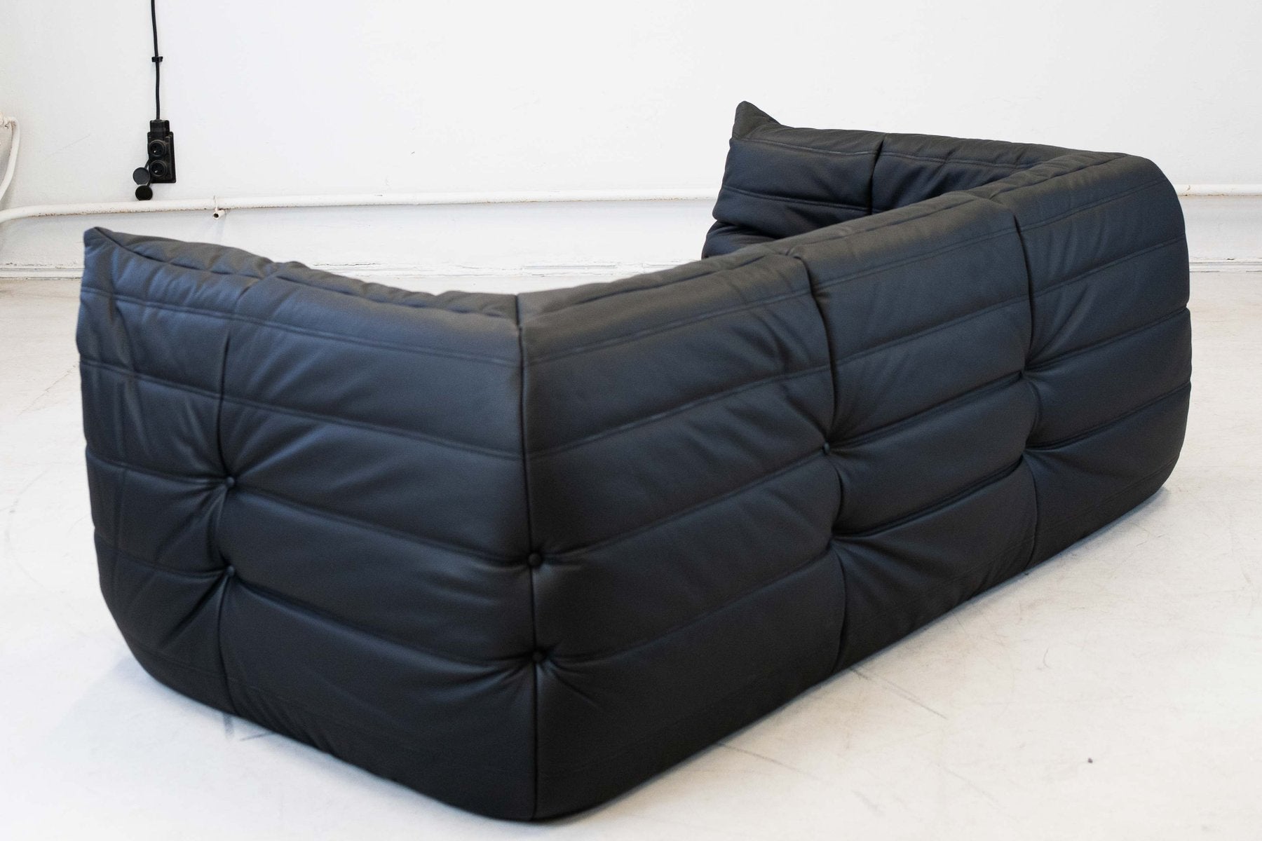 Togo_Two-Seater_Sofa_with_Arms_in_Black_Leather_by_Michel_Ducaroy_for_Ligne_Roset,_France,_1970s