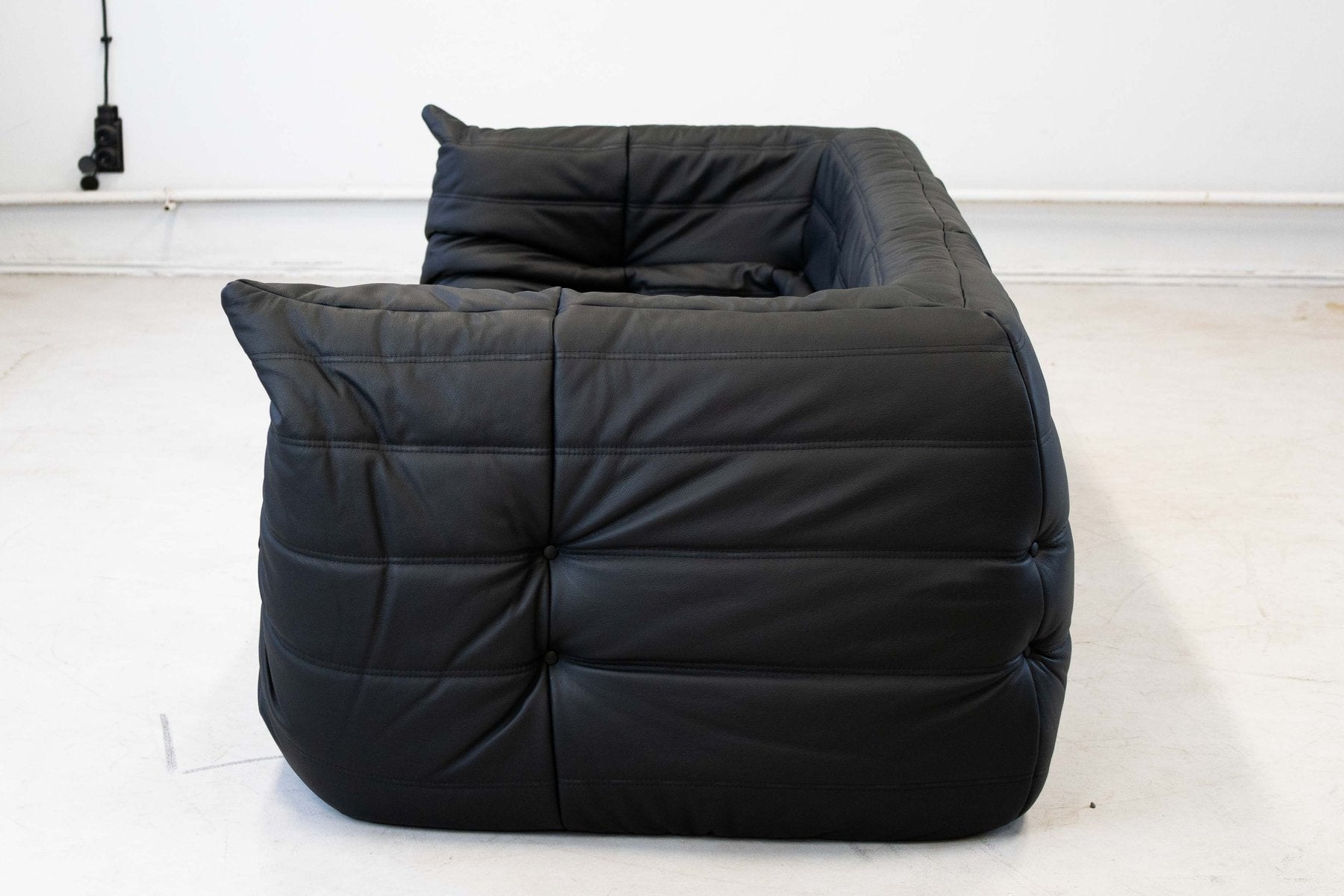Togo_Two-Seater_Sofa_with_Arms_in_Black_Leather_by_Michel_Ducaroy_for_Ligne_Roset,_France,_1970s
