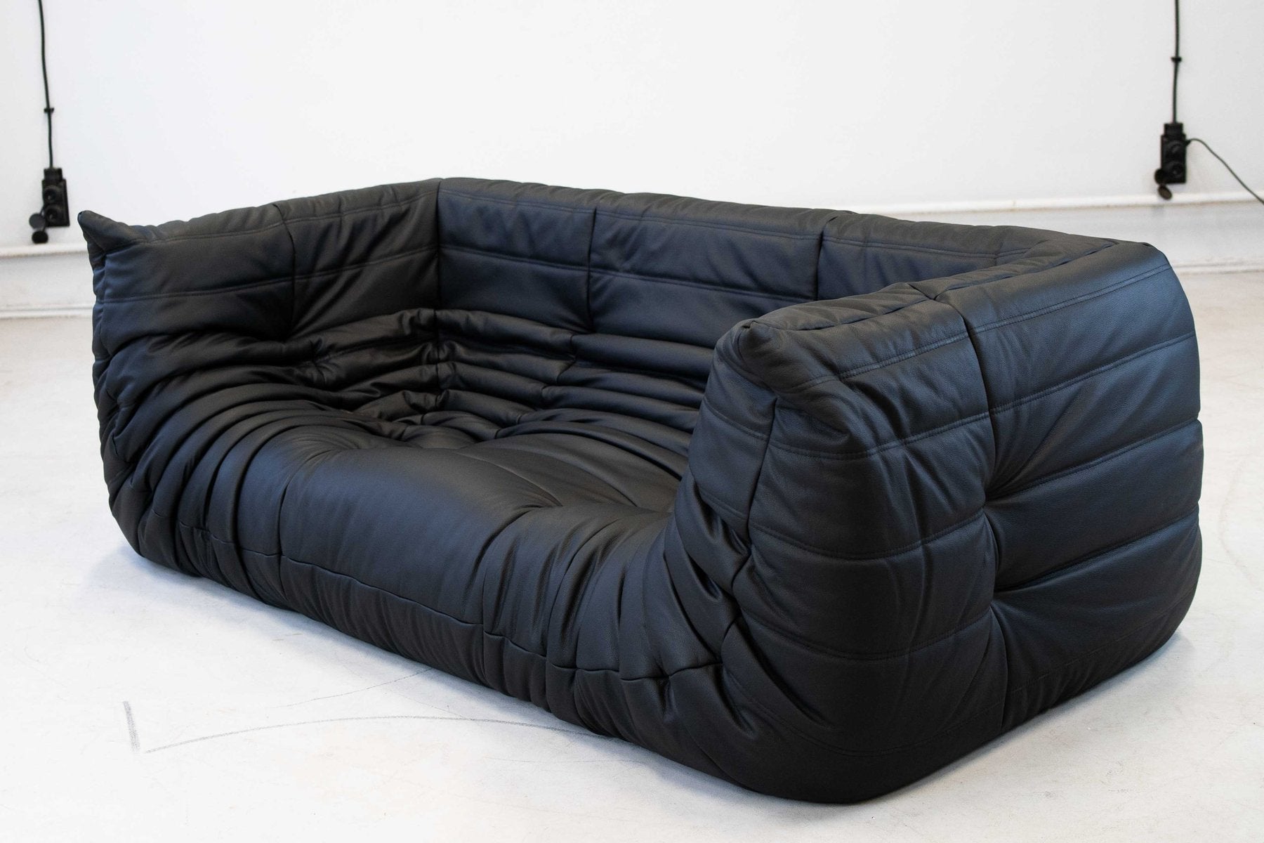 Togo_Two-Seater_Sofa_with_Arms_in_Black_Leather_by_Michel_Ducaroy_for_Ligne_Roset,_France,_1970s