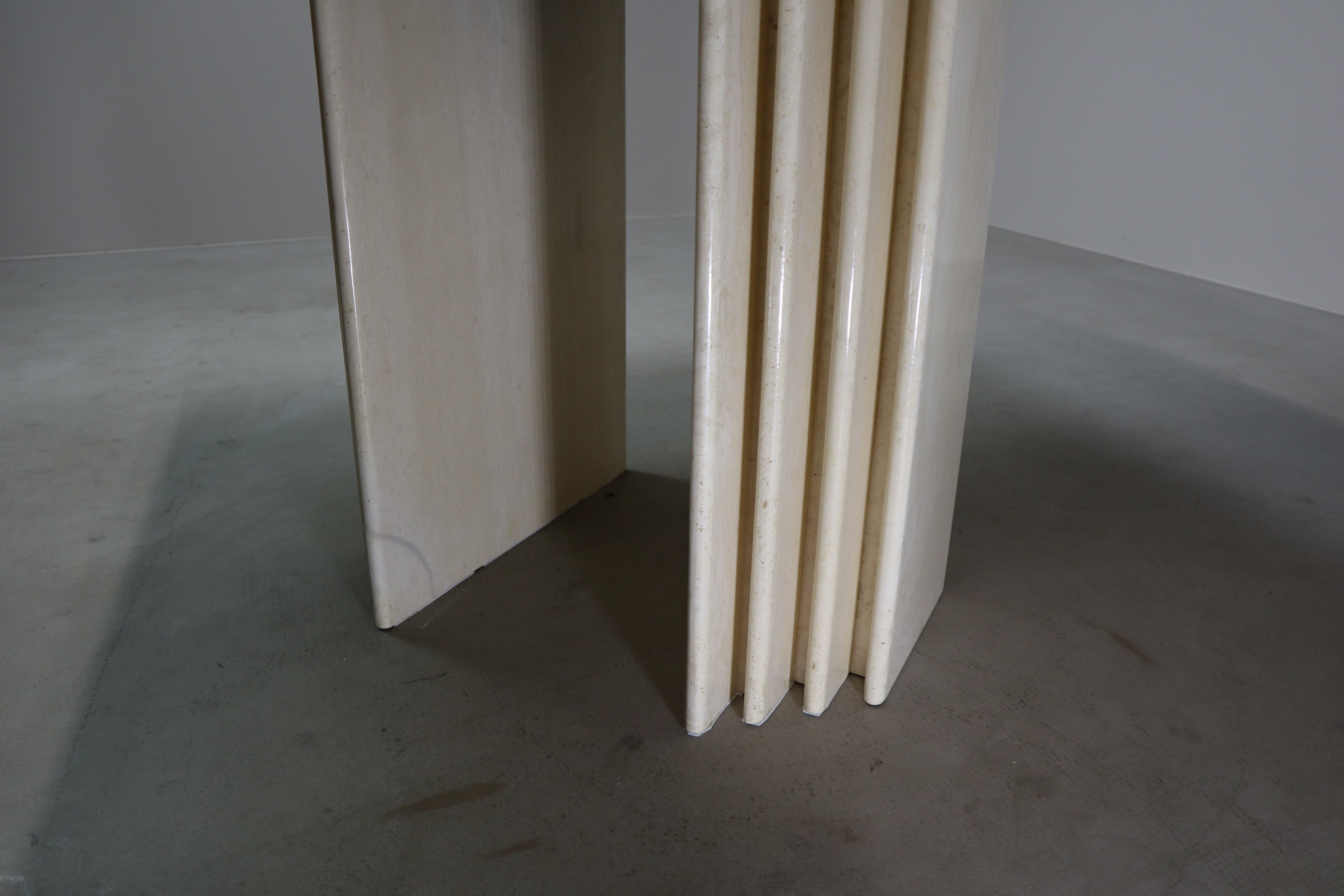 Travertine_dining_table_with_sculptural_base,_Italy_1960s