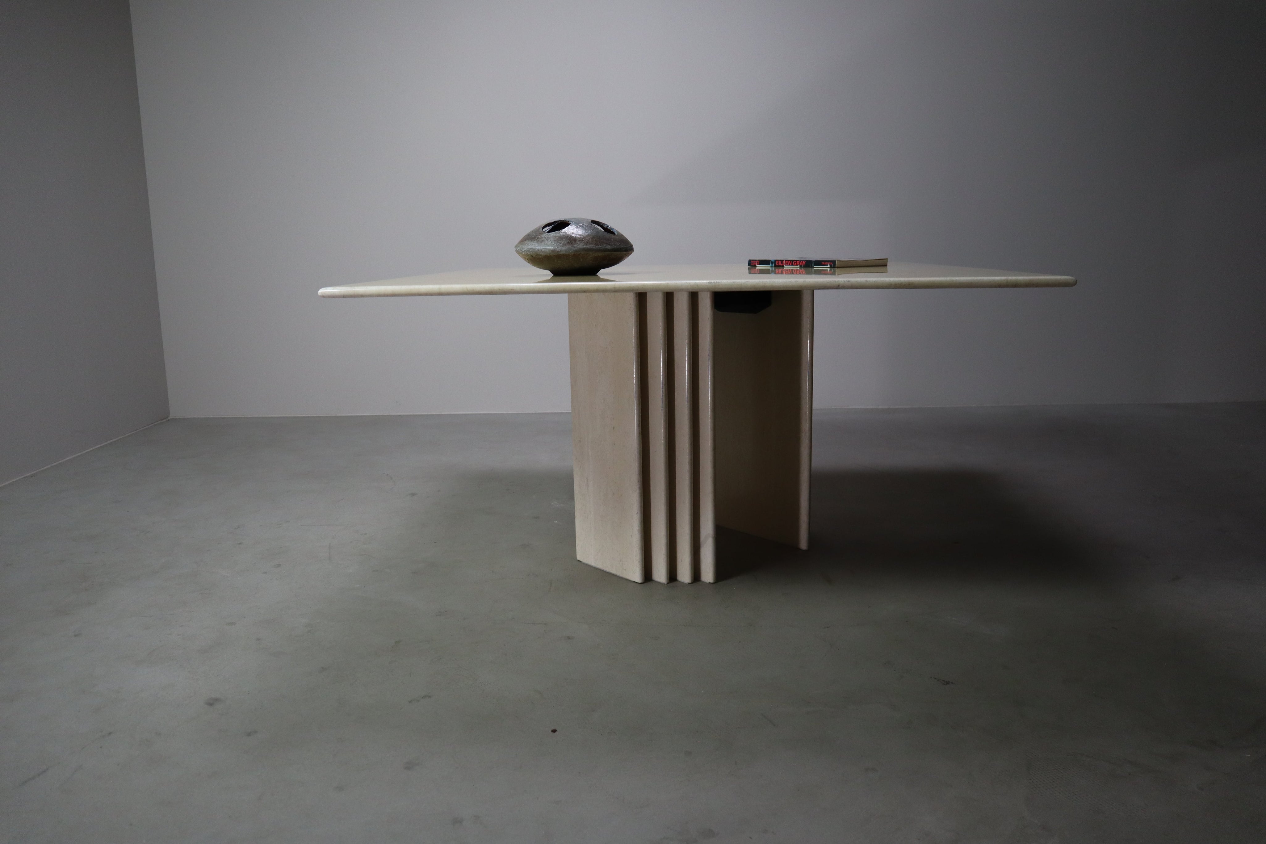 Travertine_dining_table_with_sculptural_base,_Italy_1960s