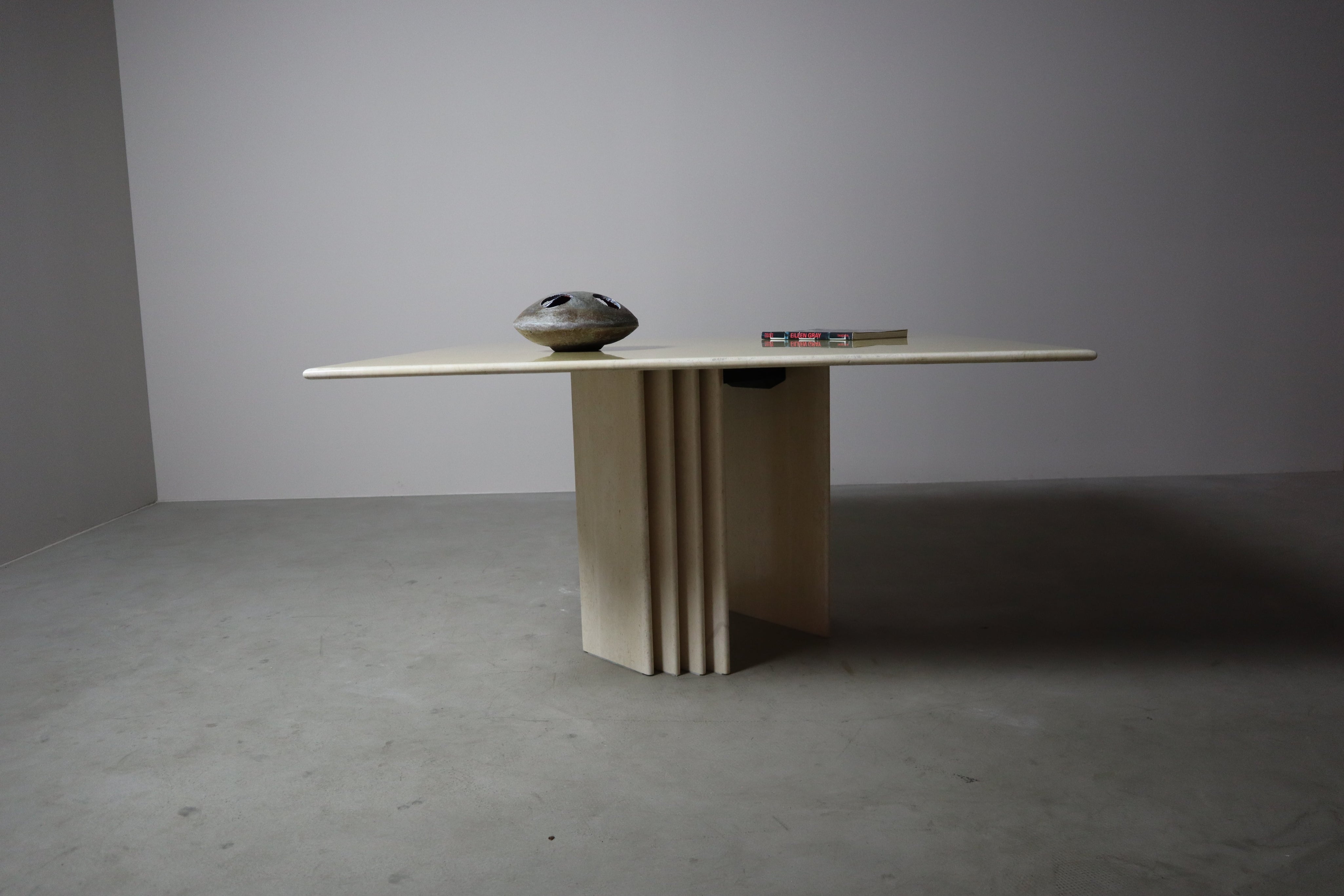 Travertine_dining_table_with_sculptural_base,_Italy_1960s