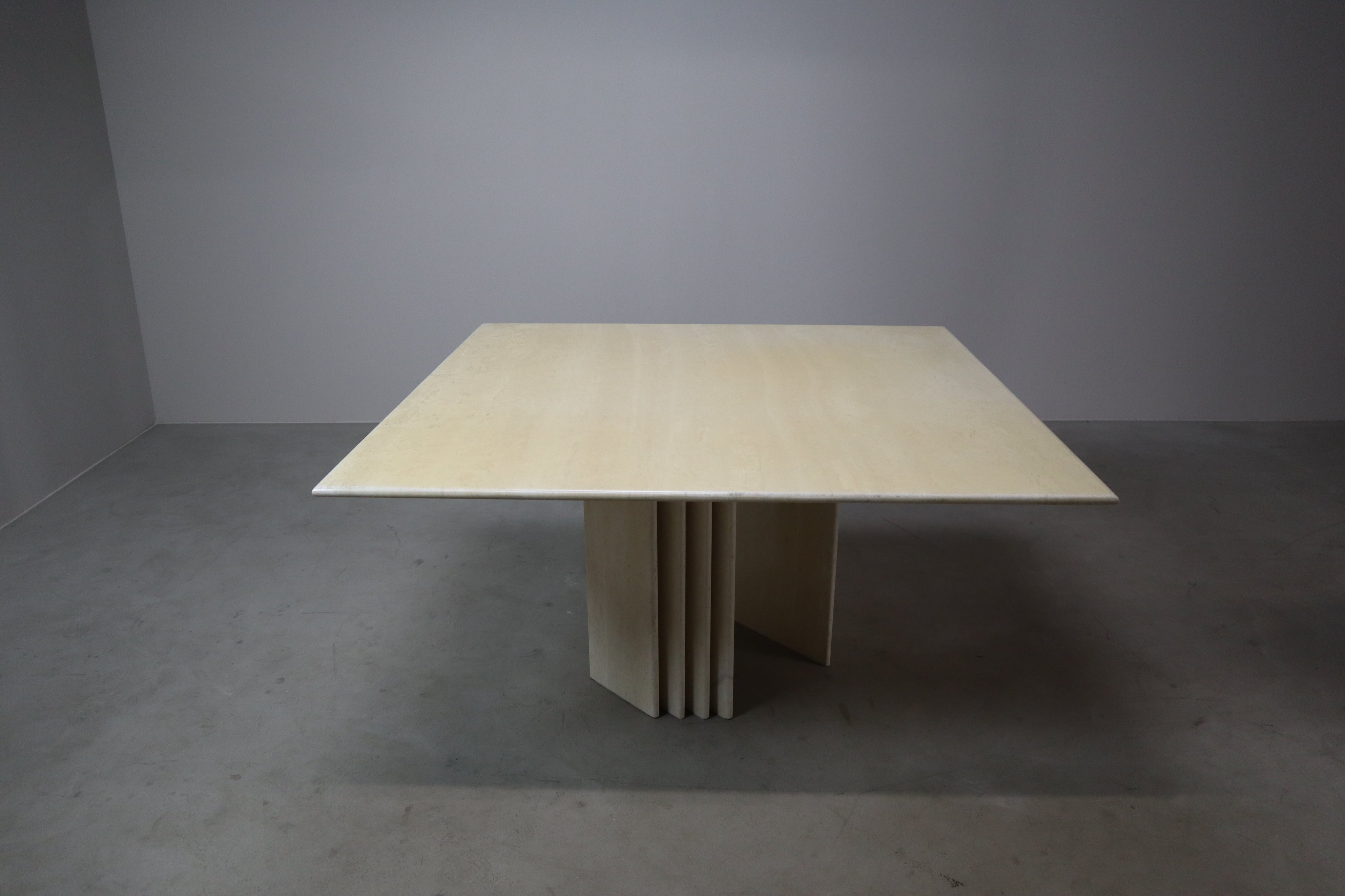 Travertine_dining_table_with_sculptural_base,_Italy_1960s