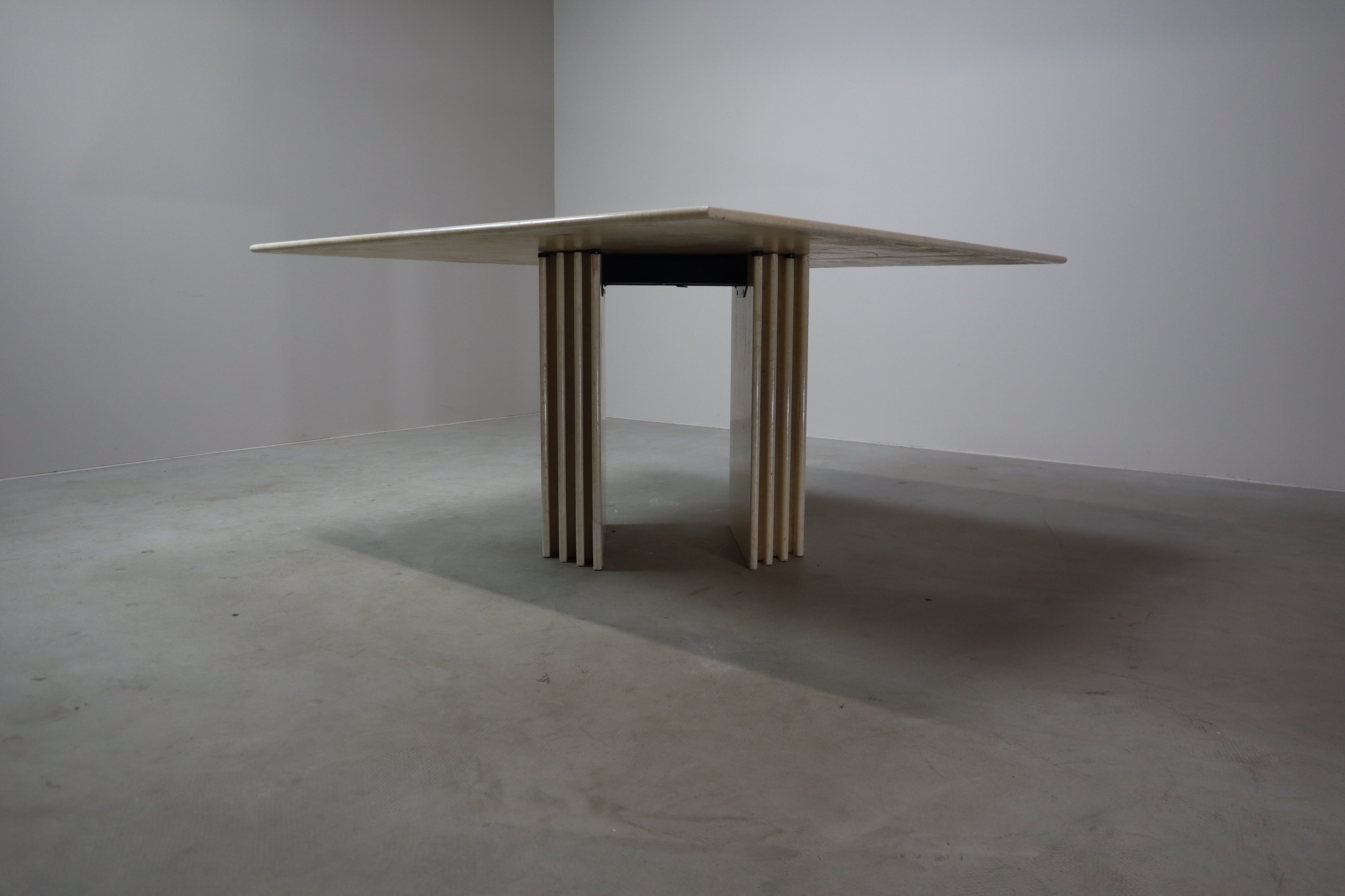 Travertine_dining_table_with_sculptural_base,_Italy_1960s