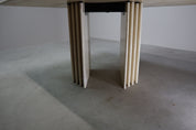 Travertine_dining_table_with_sculptural_base,_Italy_1960s