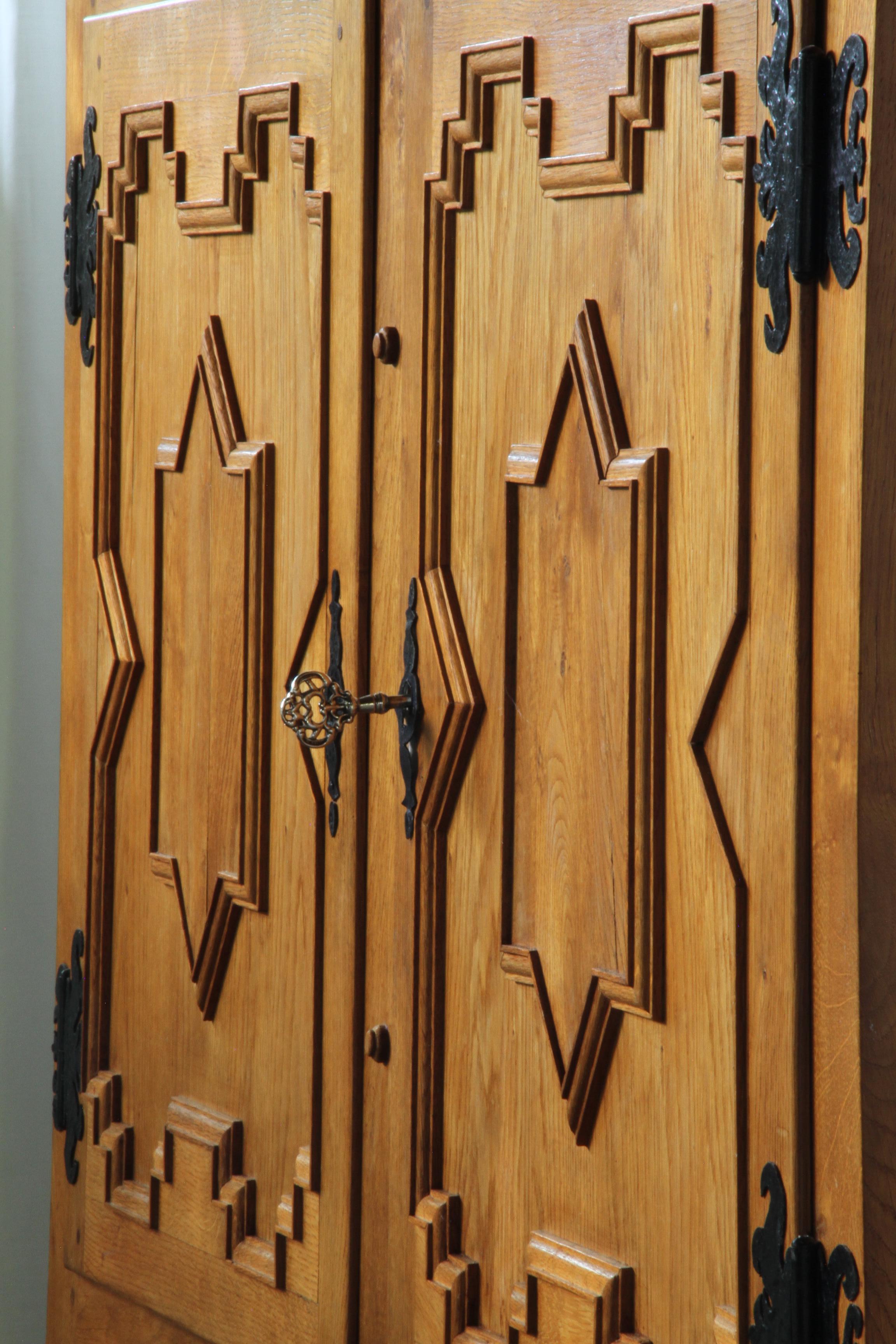 Danish_Brutalist_Oak_Cabinet_with_Carved_Geometric_Doors_and_Iron_Hinges,_Henning_Kjærnulf_Style,_1960s