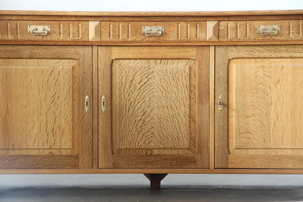 Danish_Brutalist_Solid_Oak_Low_Sideboard_with_Carved_Geometric_Doors,_Attributed_to_Henning_Kjærnulf