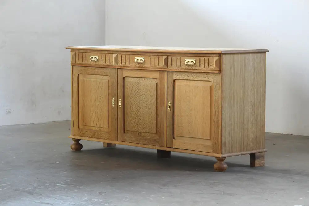 Danish_Brutalist_Solid_Oak_Low_Sideboard_with_Carved_Geometric_Doors,_Attributed_to_Henning_Kjærnulf