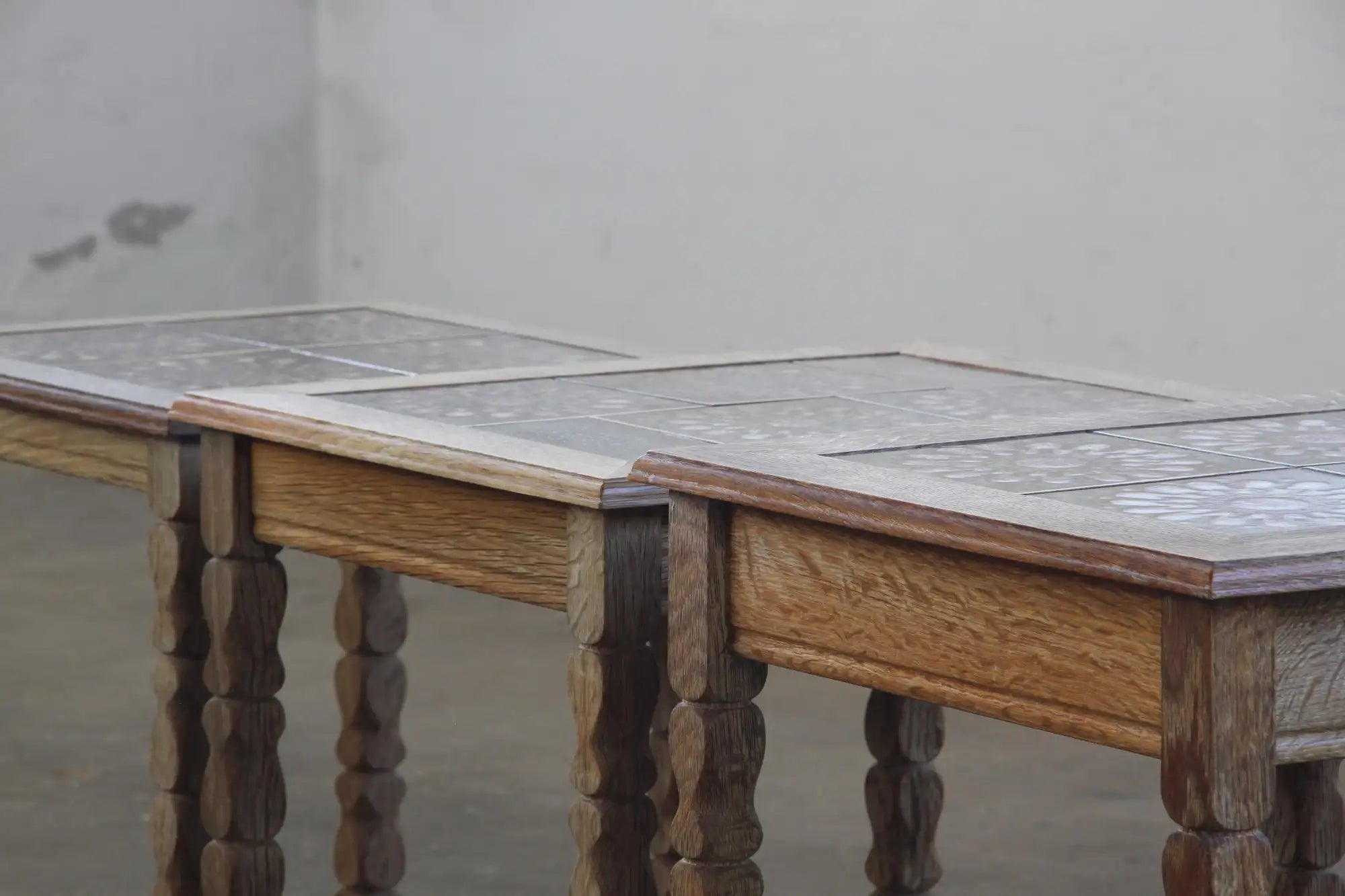 Set_of_3_Danish_Brutalist_Oak_Nesting_Tables_with_Floral_Ceramic_Tiles,_Attributed_to_Henning_Kjærnulf,_1960s