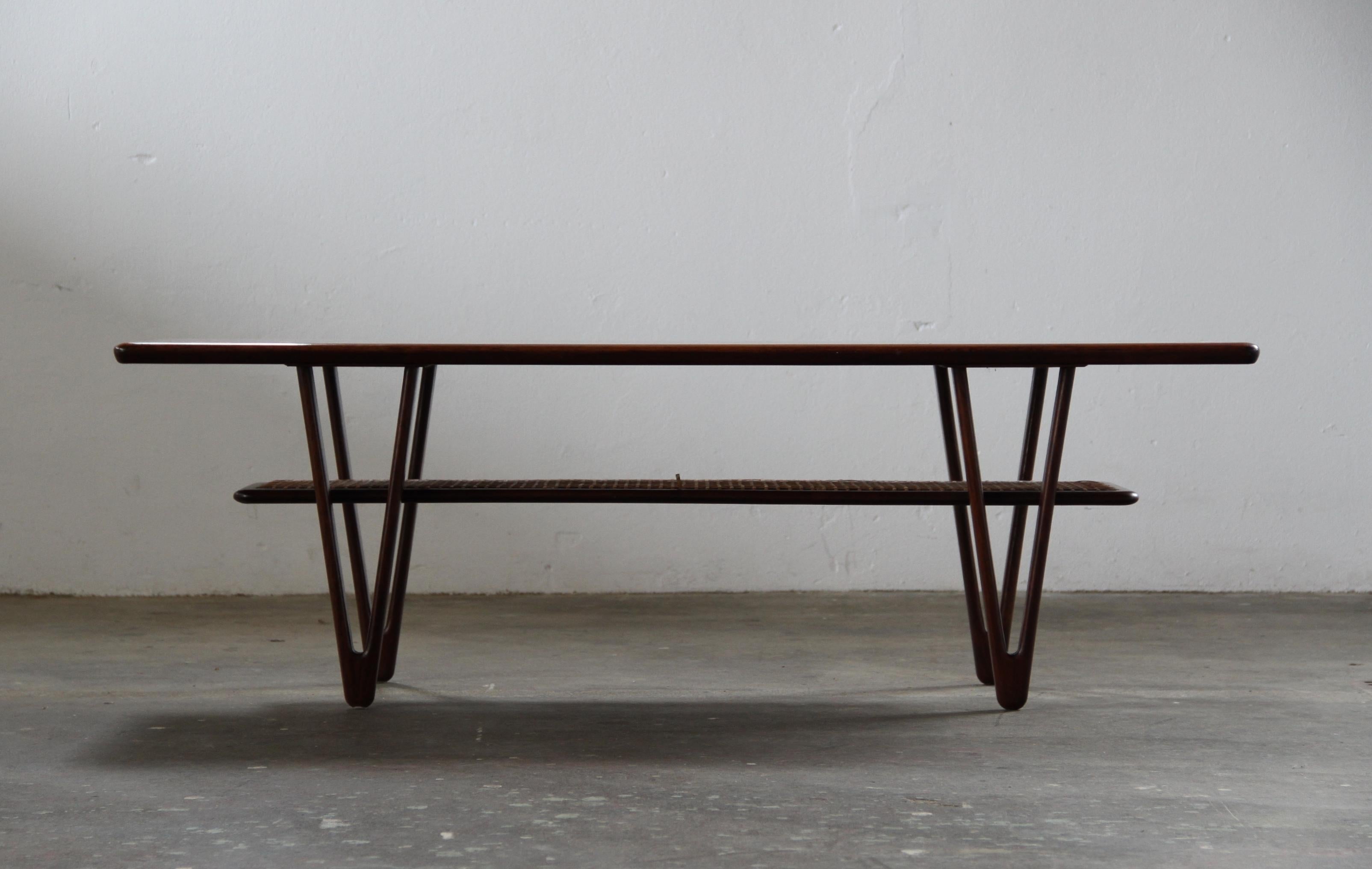 Danish_Mid-Century_Modern_Solid_Teak_Coffee_Table_with_Cane_Shelf_by_Kurt_Østervig,_1950s