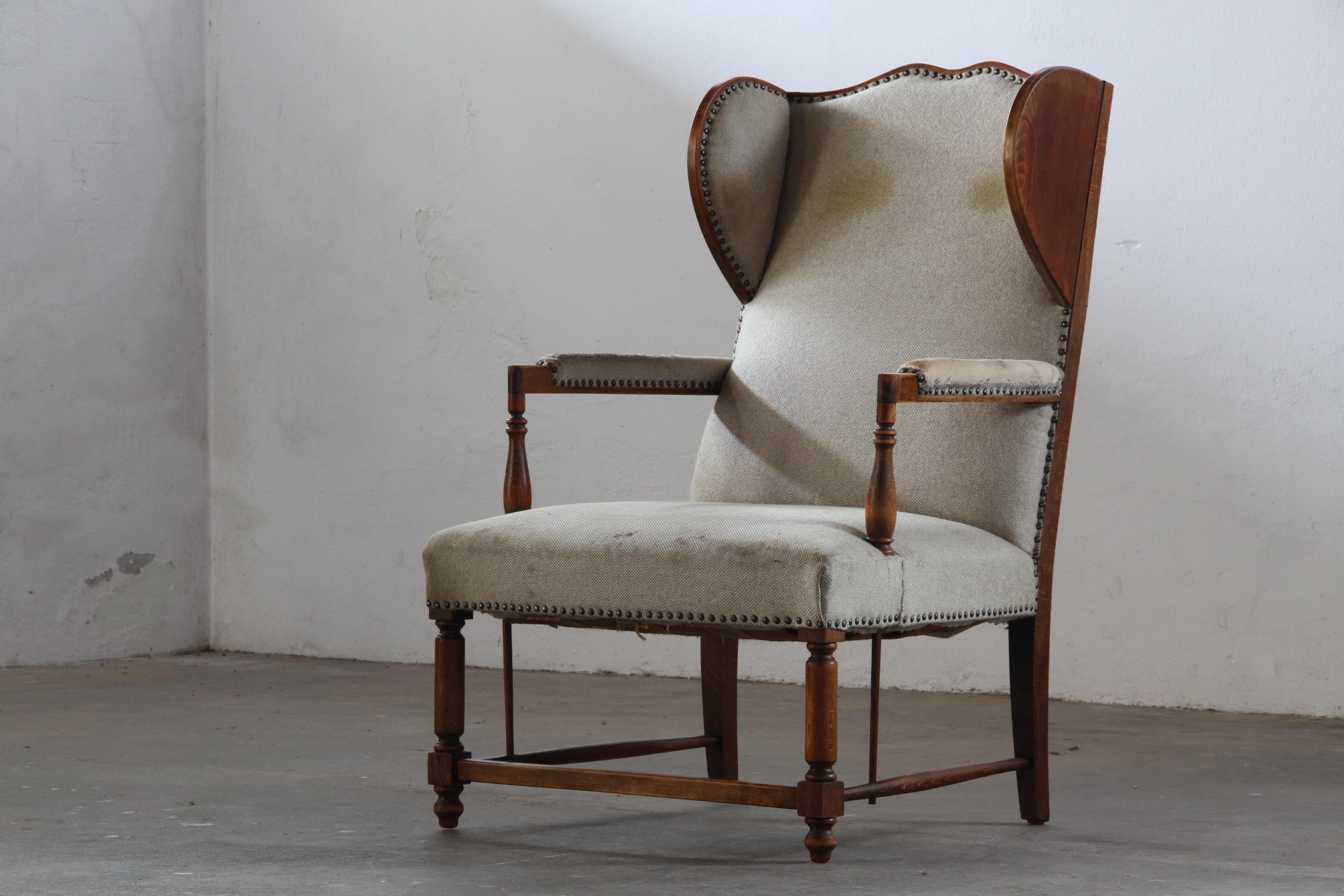 Vintage_Wingback_Armchair_with_Turned_Hardwood_Legs_and_Nailhead_Trim,_For_Reupholstery