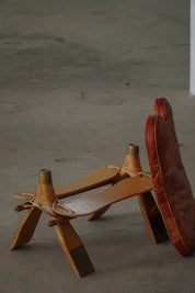 Vintage_Moroccan_Camel_Saddle_Footstool_in_Dark_Red_Upholstery,_Mid_20th_Century
