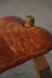 Vintage_Moroccan_Camel_Saddle_Footstool_in_Dark_Red_Upholstery,_Mid_20th_Century