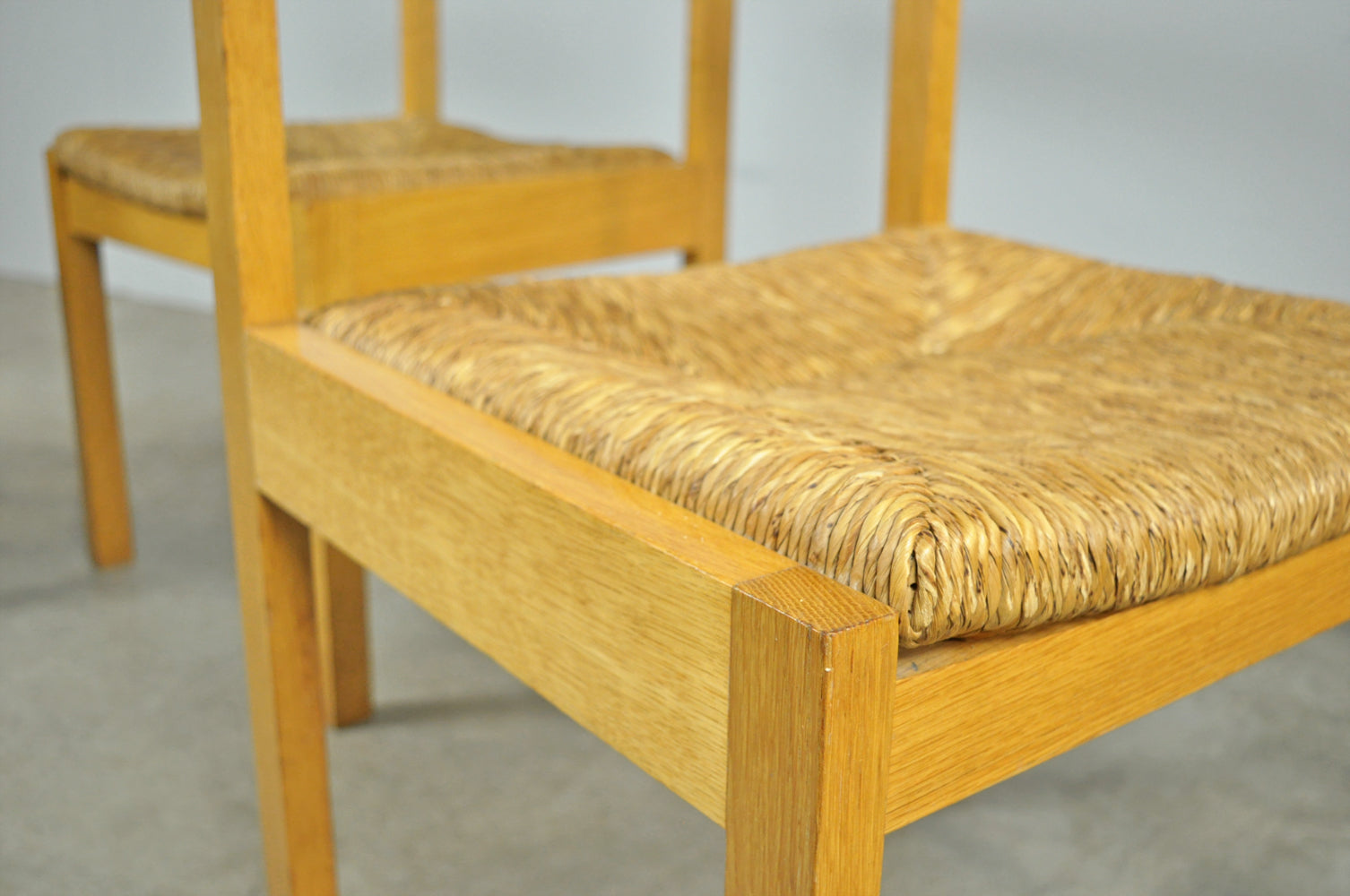 Set_of_4_Vintage_oak_with_wicker_dining_chairs_by_Gerard_Geytenbeek,_1960s