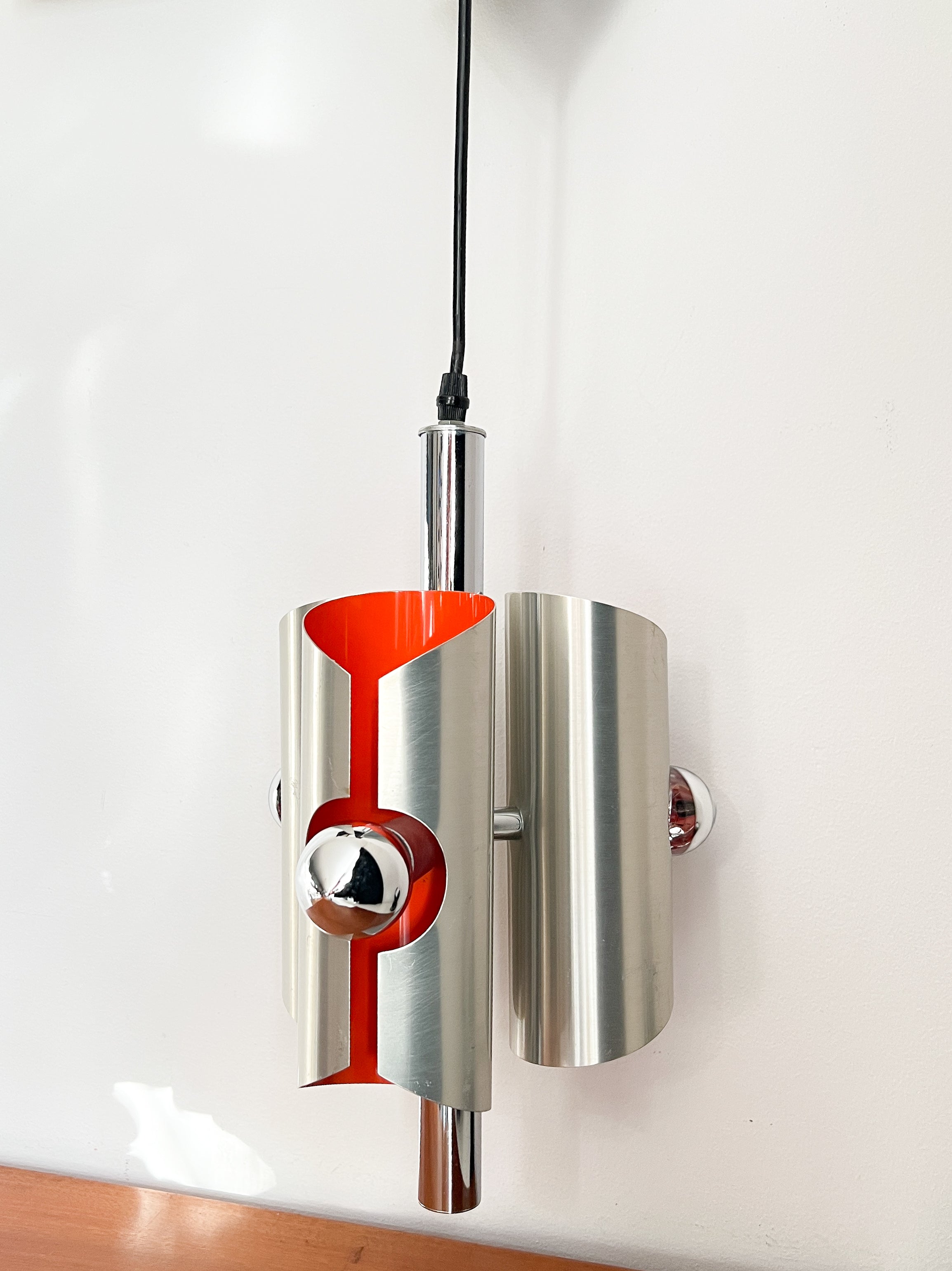 Space_Age_Chrome_Pendant_Lamp_by_Polam_with_Orange_Interior,_1960s