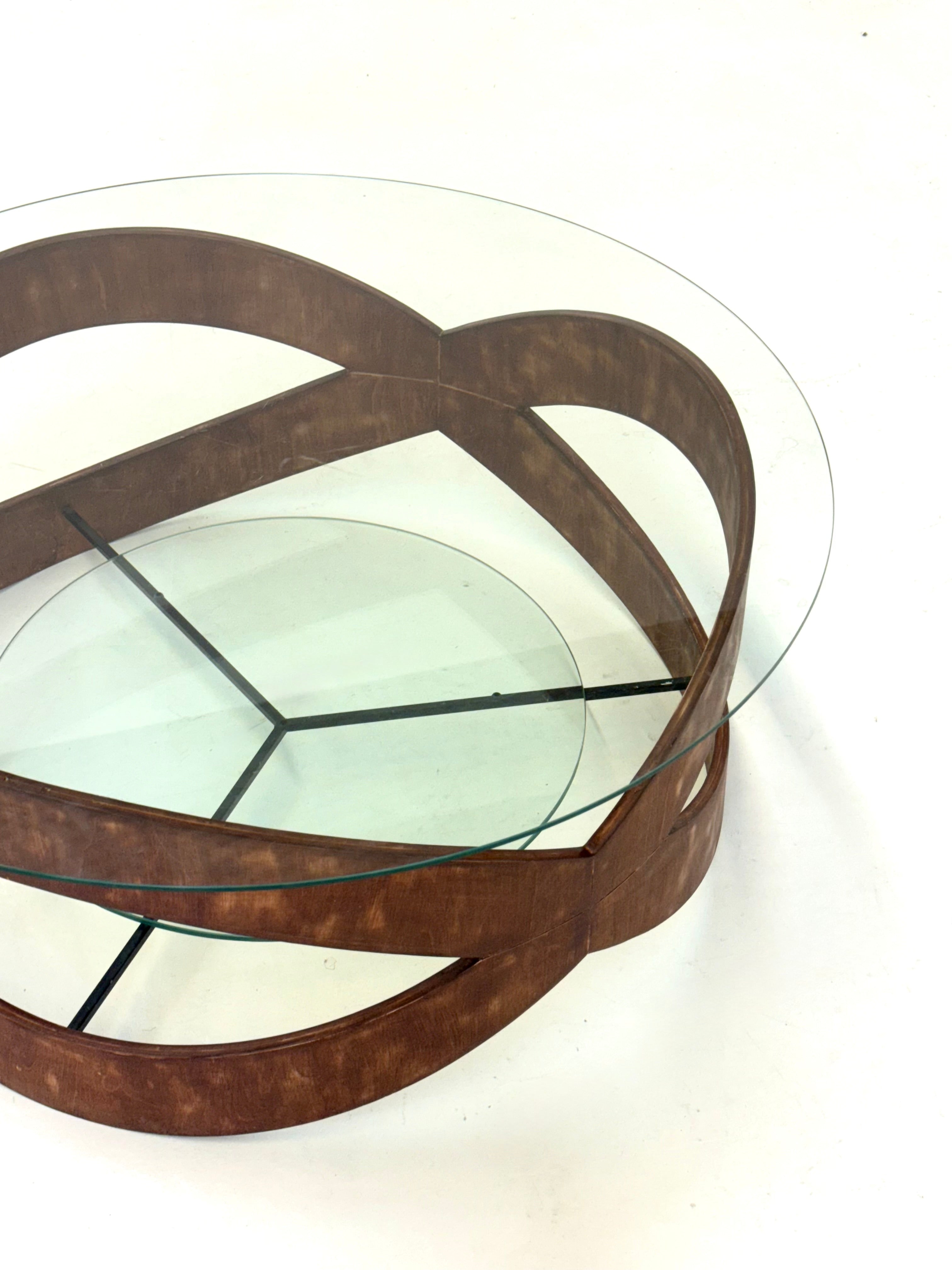Vintage_round_coffee_table_with_sculptural_wooden_frame