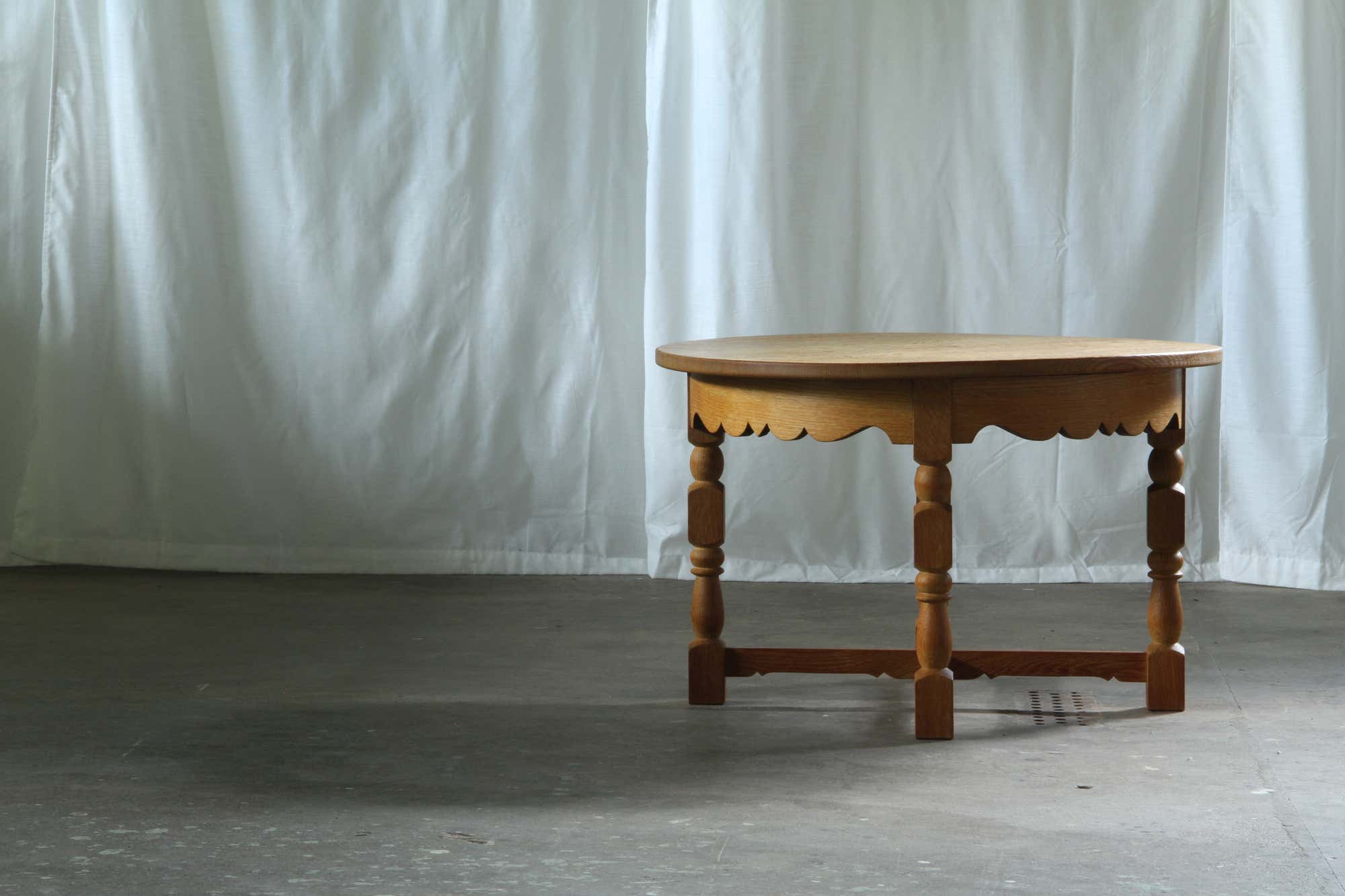 Danish_Brutalist_Round_Oak_Coffee_Table_in_the_Style_of_Henning_Kjærnulf,_1960s